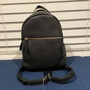Black mini backpack.